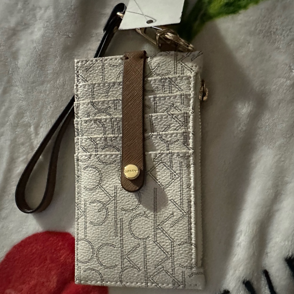 Calvin Klein wallet or can be used on your keys, NWT. White with CK all over it